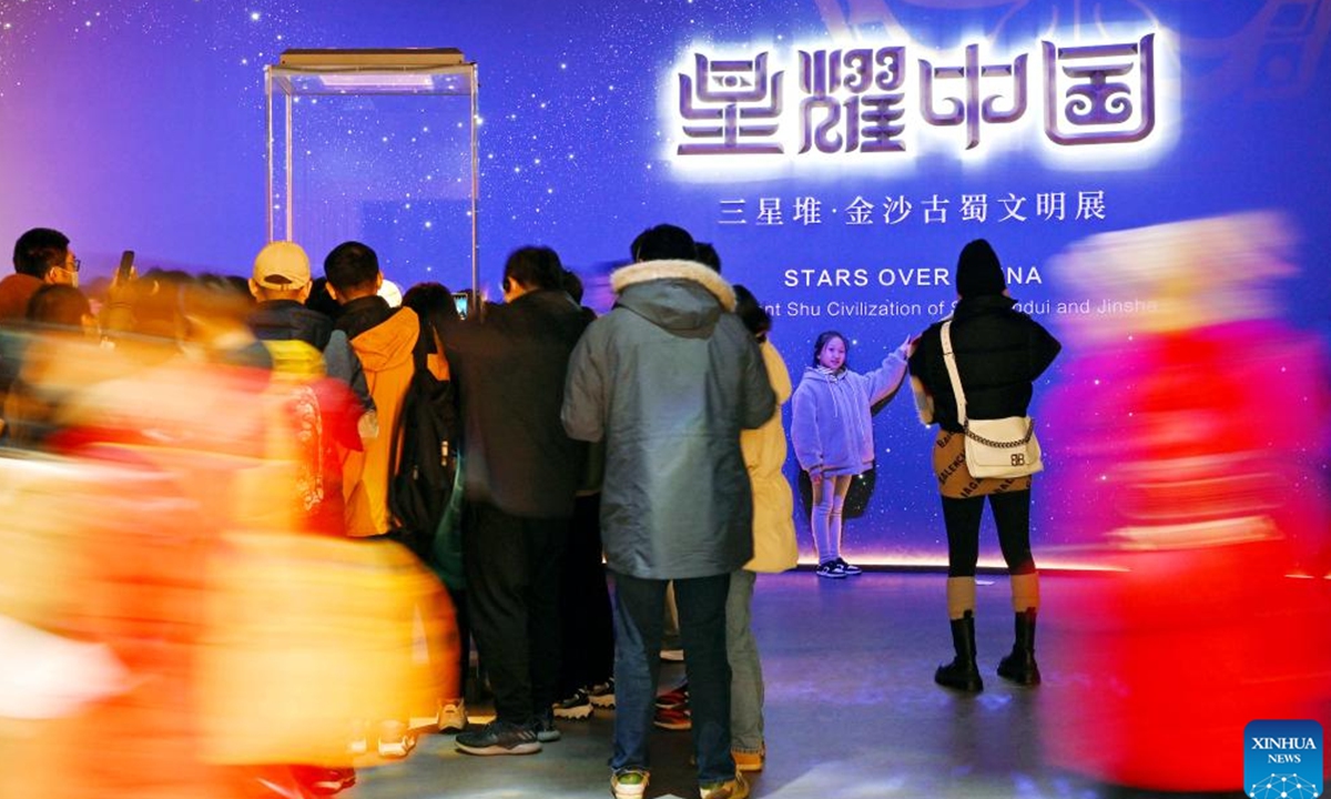 Visitors enter the hall of the exhibition of Stars over China: The Ancient Shu Civilization of Sanxingdui and Jinsha in Shanghai Museum, Shanghai, east China, Feb. 15, 2024. (Xinhua/Liu Ying)