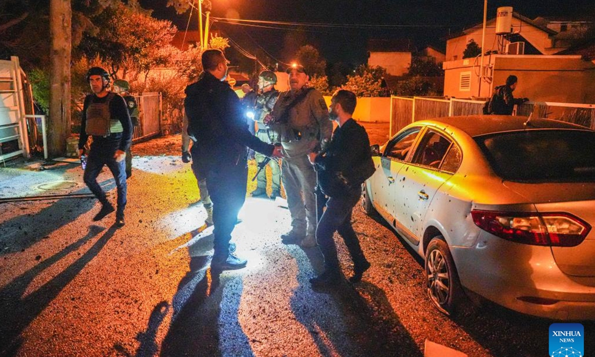 Israeli security forces work at the scene of a rocket attack from Lebanon in Kiryat Shmona, northern Israel, on Feb. 15, 2024. Hezbollah fired on Thursday evening dozens of rockets on Kiryat Shmona, a city in northern Israel, to retaliate Israel's deadly attacks on Lebanon's southern city of Nabatieh, the Lebanese armed group said in a statement. (Ayal Margolin/JINI via Xinhua)
