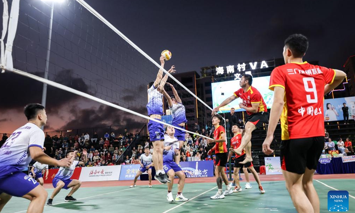 Players participate in a village volleyball match in Wenchang, south China's Hainan Province, Feb. 2, 2024. (Xinhua/Zhang Liyun)
