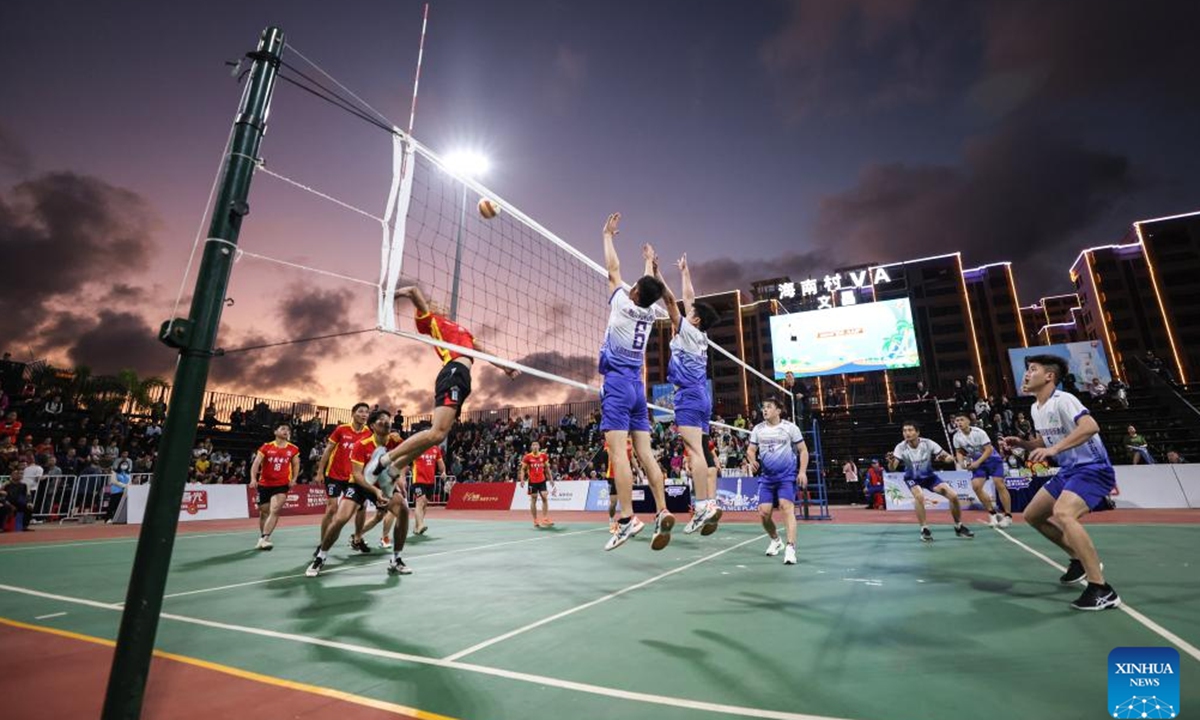 Players participate in a village volleyball match in Wenchang, south China's Hainan Province, Feb. 2, 2024. (Xinhua/Zhang Liyun)