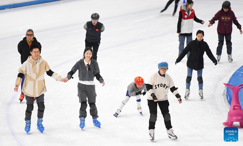 People enjoy skating at the National Speed Skating Oval in Beijing, capital of China, Feb. 16, 2024. In addition to following traditional customs, more and more Chinese People choose to enrich their life by spending the Spring Festival holiday in diversified and original ways. (Photo: Xinhua)