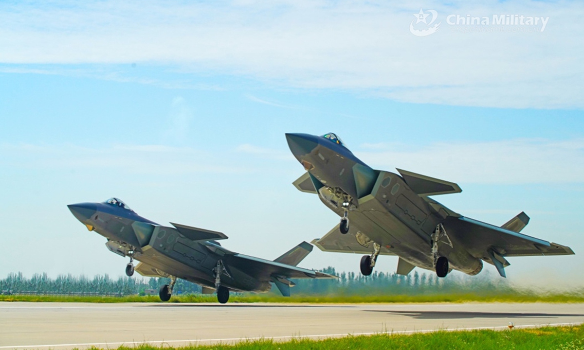 Two J-20 stealth fighter jets attached to an aviation brigade of the PLA Air Force take off for a flight training exercise in early February of 2024. (eng.chinamil.com.cn/Photo by Liu Weipeng)