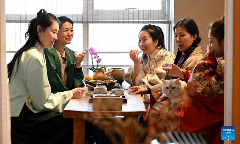 People enjoy tea and music in a club in Qiaoxi District of Shijiazhuang, north China's Hebei Province, on Feb. 16, 2024. In addition to following traditional customs, more and more Chinese people choose to enrich their life by spending the Spring Festival holiday in diversified and original ways. (Photo: Xinhua)
