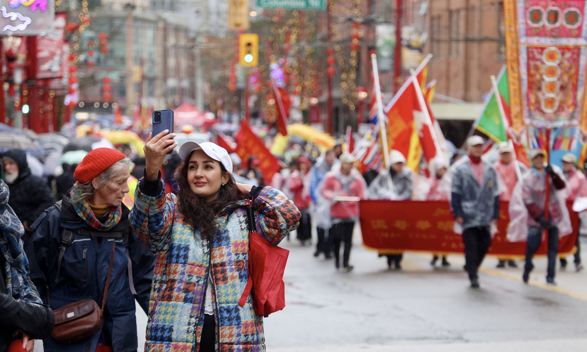 Tourists enjoy the Chinese New Year parade by the local Chinese community in Vancouver, Canada on February 11, 2024. Photo: VCG