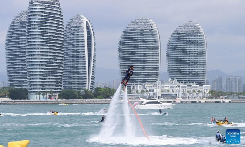 People experience water sports in Sanya, south China's Hainan Province, on Feb. 15, 2024. In addition to following traditional customs, more and more Chinese people choose to enrich their life by spending the Spring Festival holiday in diversified and original ways. (Photo: Xinhua)
