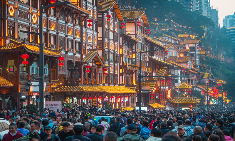 Tourists crowd the Hongyadong scenic area in Chongqing on February 12, 2024. Photo: VCG