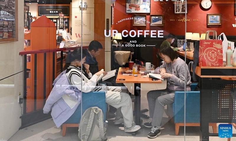 Citizens read books at a bookstore in Xiqing District, north China's Tianjin, on Feb. 16, 2024. In addition to following traditional customs, more and more Chinese people choose to enrich their life by spending the Spring Festival holiday in diversified and original ways. (Photo: Xinhua)