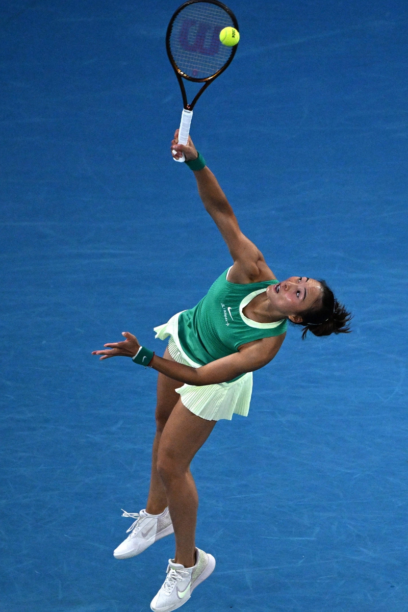 Zheng Qinwen serves against Aryna Sabalenka during their women's singles final match of the Australian Open in Melbourne on January 27, 2024. Photo: VCG
