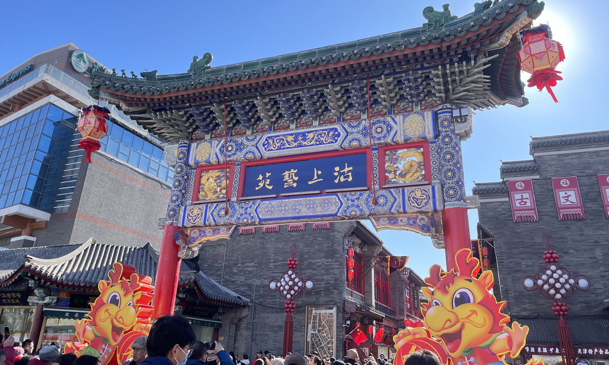 Tourists enjoy themselves at the Tianjin Ancient Culture Street during the Spring Festival holidays. Photo: Chen Xi/GT