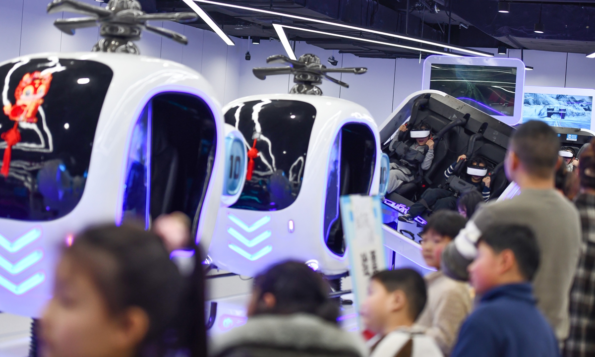 Children experience virtual reality games at the aviation science and technology museum in the Luogang Central Park in Hefei, East China's Anhui Province, on February 18, 2024. Photo: VCG