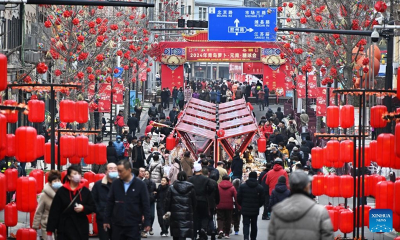 Tourists have fun during a fair in celebration of the Chinese Lunar New Year in Qingdao, east China's Shandong Province, Feb. 18, 2024. The fair featuring lantern show, dragon dance and specialty food attracted many tourists here.(Photo: Xinhua)