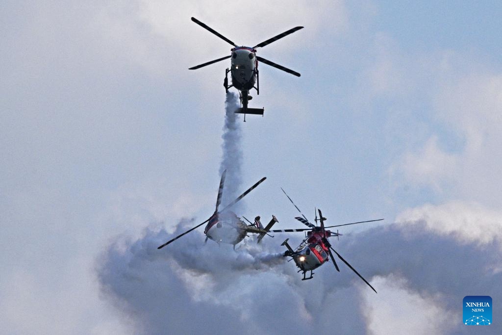 Indian Air Force's aerobatic team Sarang perform during the media preview of Singapore Airshow in Singapore, Feb. 18, 2024.(Photo: Xinhua)