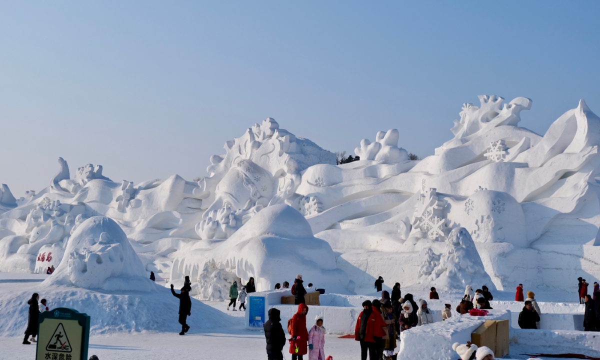 Visitors appreciate a giant snow sculpture at the 36th Sun Island International Snow Sculpture Expo in Harbin, Northeast China's Heilongjiang Province, during the Spring Festival. Photo: Bi Mengying/GT