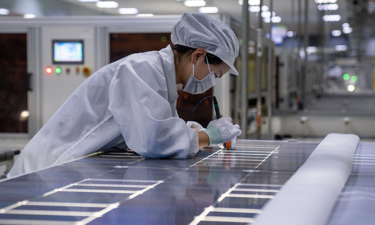A worker is checking photovoltaic modules in a company in Feidong county, Hefei, Anhui, on January 16, 2024. Photo: VCG