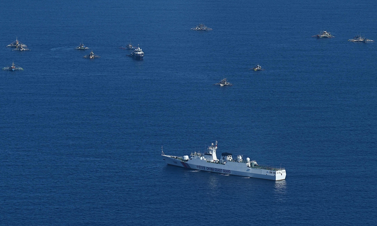 China Coast Guard vessel blocks the Philippine fishing boats during?a mission led by the Philippine Bureau of Fisheries and Aquatic Resources (BFAR) to illegally deliver supplies and assistance to fishermen in Huangyan Dao on February 15, 2024. Photo: VCG