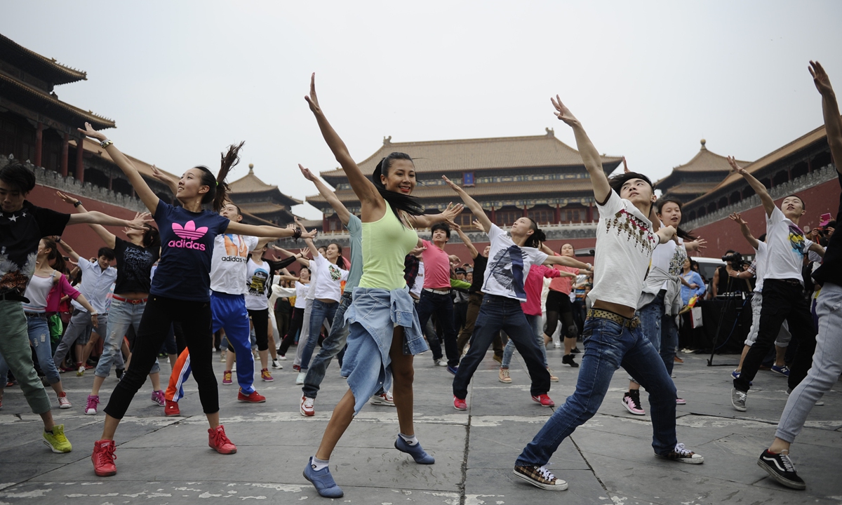 A group of young people participate in a flash mob dance event at the Forbidden City in capital Beijing. Photo: Li Hao/Global Times
