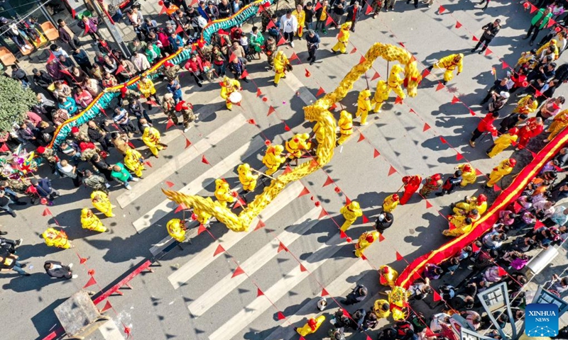 A drone photo taken on Feb. 20, 2024 shows a dragon dance performance in celebration of the upcoming Lantern Festival in Sancha Township of Bozhou District in Zunyi City, southwest China's Guizhou Province. As the Lantern Festival is approaching, traditional dragon dance performances are staged across the country in full festive atmosphere.(Photo: Xinhua)
