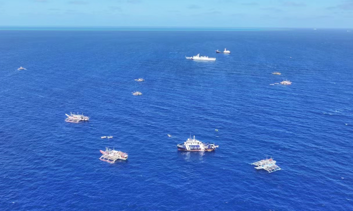 A group of Philippine fishing vessels illegally intrude waters off China's Huangyan Dao in the South China Sea last week in an organized, provocative manner. Photo: Courtesy of a source familiar with the matter