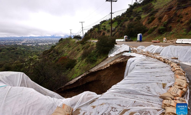 Lanes of Mulholland Drive are damaged by mudslides in Los Angeles, California, the United States, Feb. 20, 2024. A powerful storm continues to slam the U.S. West Coast on Tuesday with heavy rain, snow and wind, as flood watch remains in effect across California.(Photo: Xinhua)