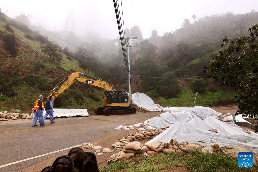 Lanes of Mulholland Drive are damaged by mudslides in Los Angeles, California, the United States, Feb. 20, 2024. A powerful storm continues to slam the U.S. West Coast on Tuesday with heavy rain, snow and wind, as flood watch remains in effect across California.(Photo: Xinhua)