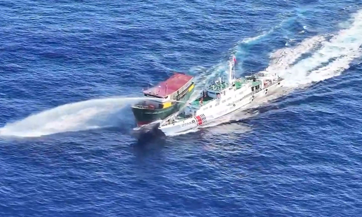 A Chinese coast guard ship uses a water cannon to expel a Philippine Coast Guard ship near the South China Sea during the Philippines' illegal re-supply mission on March 5, 2024. Photo: VCG