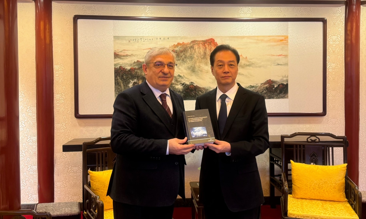 Turkish Ambassador to China Ismail Hakki Musa (left) meets with CPIFA chief Wang Chao on February 20, 204. Photo: Courtesy of Turkish Embassy in China
