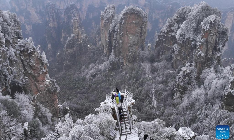 An aerial drone photo taken on Feb. 22, 2024 shows scenery of the Zhangjiajie National Forest Park after snowfall in central China's Hunan Province.(Photo: Xinhua)