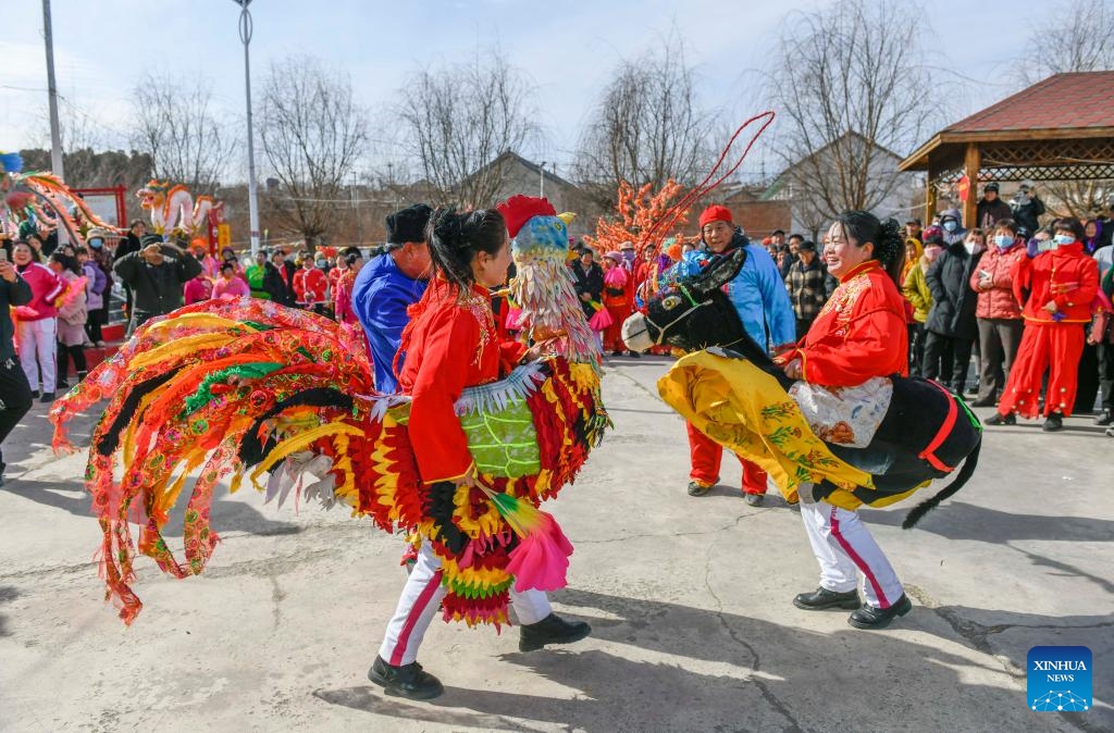 Folk artists dance in celebration of the upcoming Lantern Festival in Shiqiaotou Village of Zunhua City, north China's Hebei Province, Feb. 22, 2024. The Lantern Festival falls on Feb. 24 this year(Photo: Xinhua)