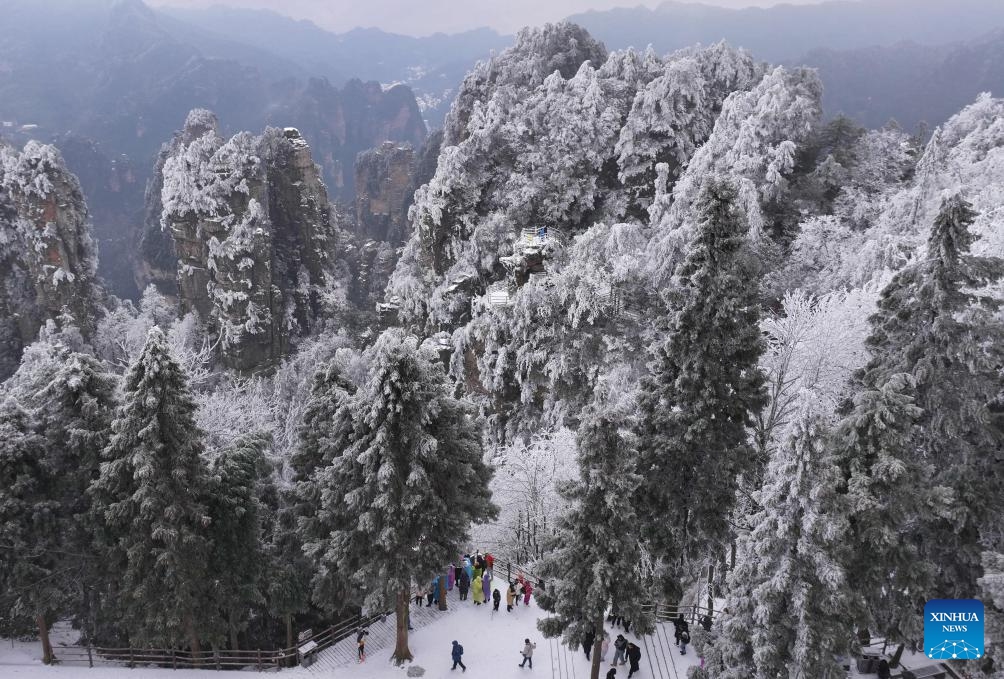 An aerial drone photo taken on Feb. 22, 2024 shows scenery of the Zhangjiajie National Forest Park after snowfall in central China's Hunan Province.(Photo: Xinhua)