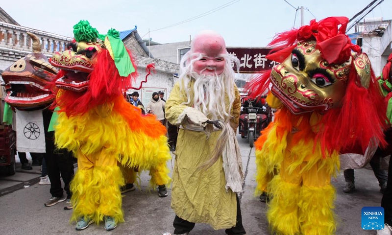Folk artists perform lion dance in celebration of the upcoming Lantern Festival in Beizhuying Village of Boai County, central China's Henan Province, Feb. 22, 2024. The Lantern Festival falls on Feb. 24 this year.(Photo: Xinhua)