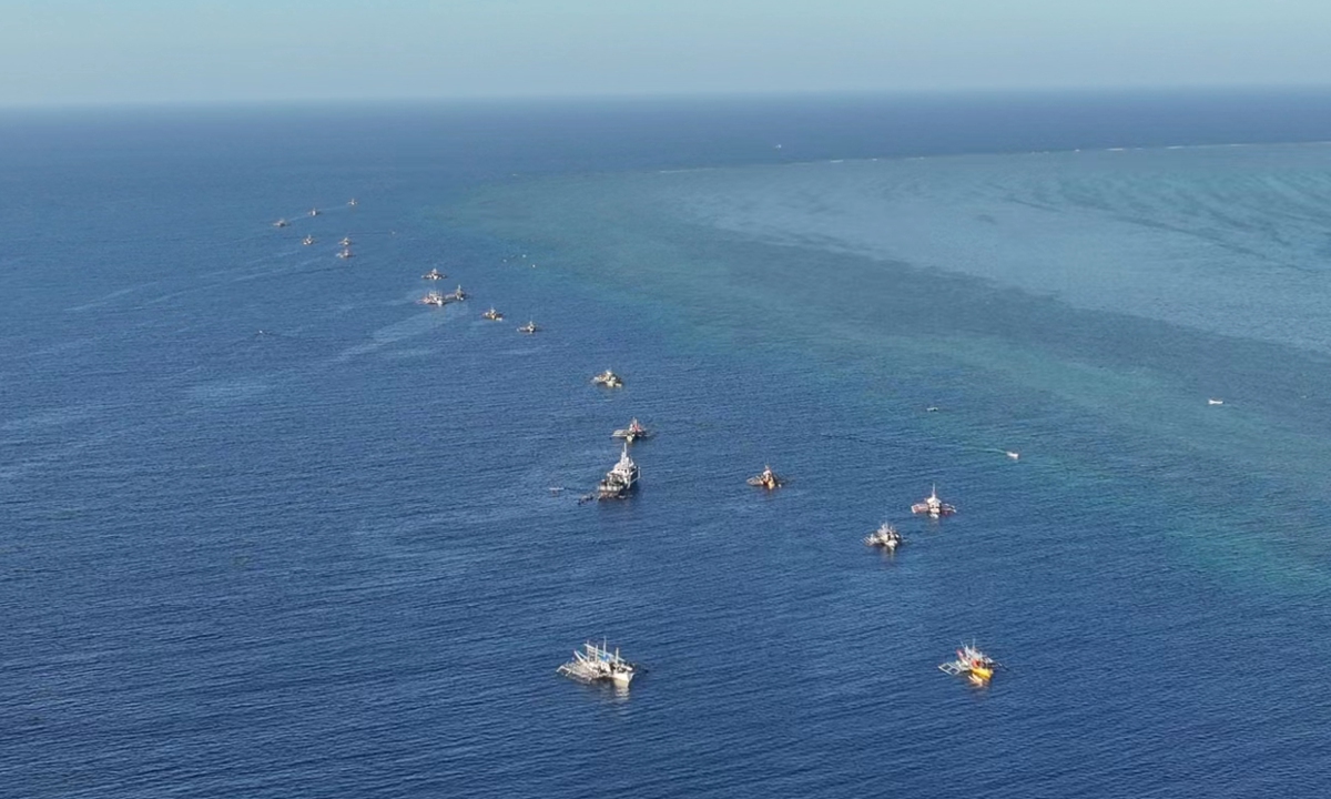 A group of Philippine fishing vessels illegally intrude waters off China's Huangyan Dao in the South China Sea last week in an organized, provocative manner. Photos: Courtesy of a source familiar with the matter