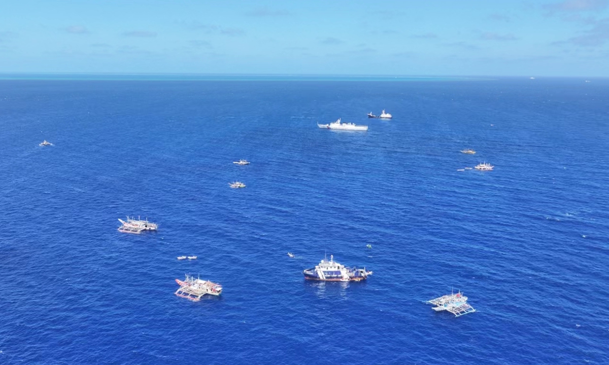 A group of Philippine fishing vessels illegally intrude waters off China's Huangyan Dao in the South China Sea last week in an organized, provocative manner. Photos: Courtesy of a source familiar with the matter