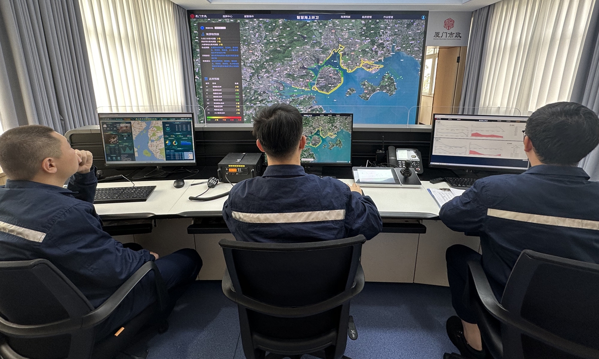 Staff members of Xiamen Municipal Marine Environmental Sanitation Management operate a remote sensing satellite system to detect environmental quality in Xiamen sea area, in East China's Fujian province, on January 25, 2024. Photo: Lin Xiaoyi/GT 