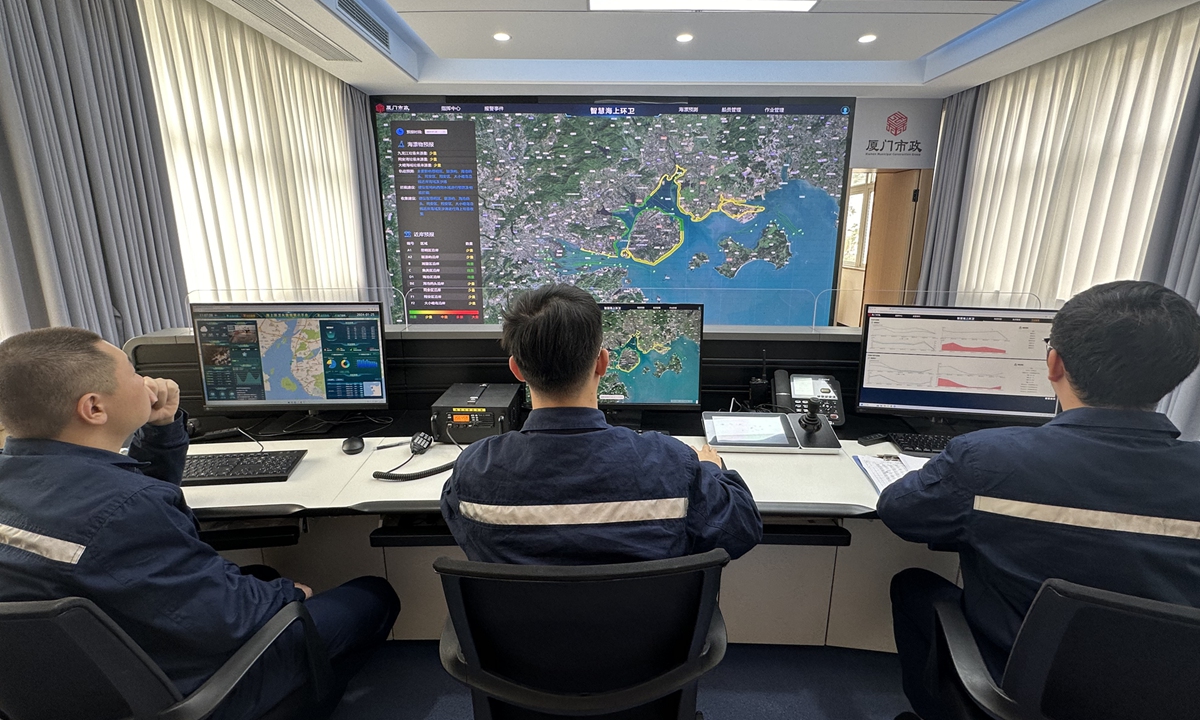 Staff members of Xiamen Municipal Marine Environmental Sanitation Management operate a remote sensing satellite system to detect environmental quality in Xiamen sea area, in East China's Fujian province, on January 25, 2024. Photo: Lin Xiaoyi/GT