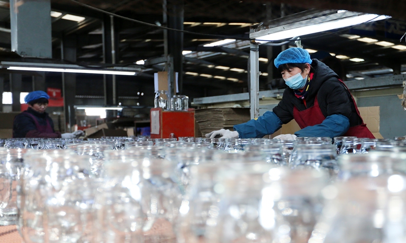 Workers manufacture glass to fill export orders on February 27, 2024 in Huaibei, East China's Anhui Province. Local enterprises are starting off strong as they catch up on orders for the Year of the Dragon. Photo: VCG
