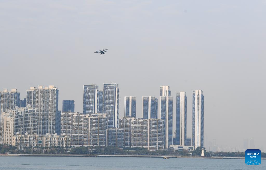 A 5-seat eVTOL (electric vertical takeoff and landing) aircraft flies during a demonstration flight near Shekou Cruise Home port in Shenzhen, south China's Guangdong Province, Feb. 27, 2024. The eVTOL aircraft, developed by a high-tech company AutoFlight and named as Prosperity, completed its first inter-city electric air-taxi demonstration flight from Shekou Cruise Home port in Shenzhen to Jiuzhou Port in Zhuhai.(Photo: Xinhua)