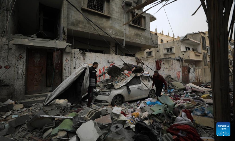 People are seen among the rubble after an Israeli airstrike in the southern Gaza Strip city of Rafah, on February 27, 2024. The Palestinian death toll in the Gaza Strip has risen to 29,878 since October 7, 2023, the Hamas-run Health Ministry said in a press statement on Tuesday. Photo: Xinhua
