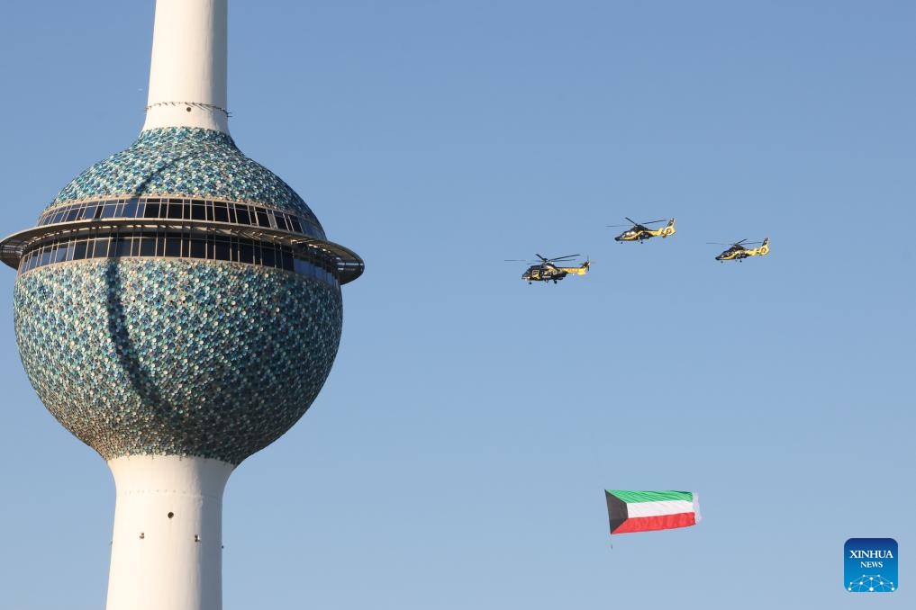 Helicopters fly during a celebration of Kuwait's national and liberation days in Capital Governorate, Kuwait, Feb. 26, 2024. Kuwaitis celebrate their national and liberation days on Feb. 25 and 26 every year.(Photo: Xinhua)