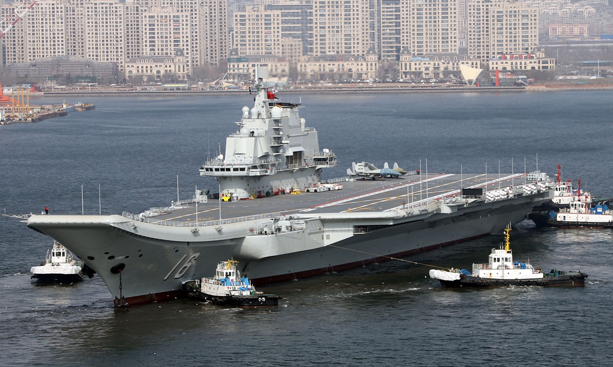  After completing a year of maintenance and upgrades, China's Liaoning aircraft carrier leaves the shipyard with the assistance of tugboats in Dalian, Northeast China's Liaoning Province, on February 29, 2024, and will next  starts a voyage test. Full-scale mockups of a J-35 fighter jet and a J-15 fighter jet can be seen on the carrier's flight deck. Photo: VCG