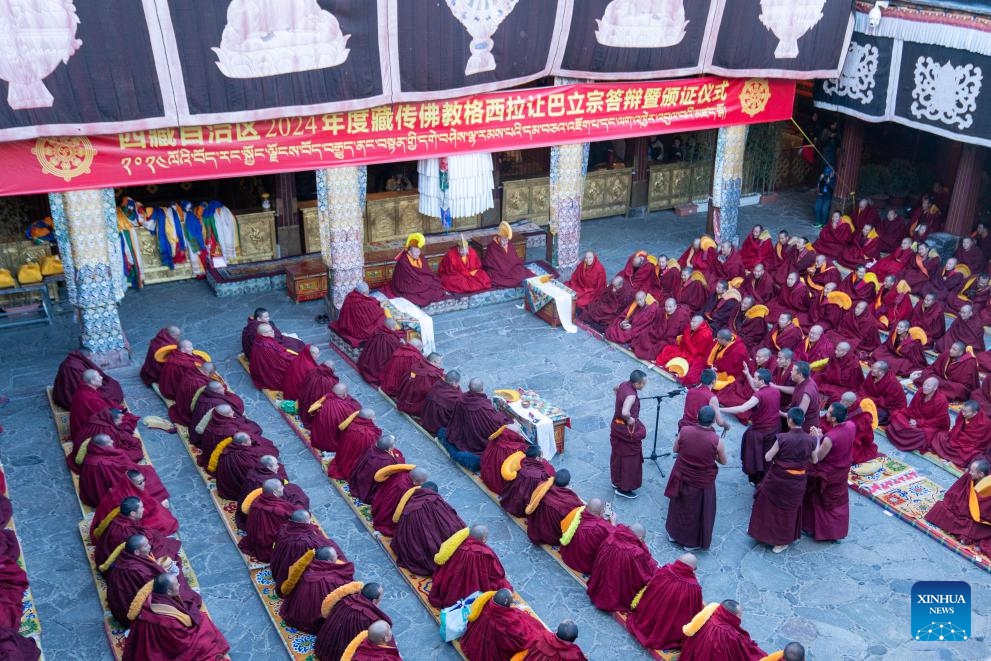Monks attend a sutra debate at the Jokhang Temple in Lhasa, capital of southwest China's Xizang Autonomous Region, Feb. 28, 2024. Twelve monks obtained the degree of Geshe Lharampa following a sutra debate Wednesday in southwest China's Xizang Autonomous Region.(Photo: Xinhua)