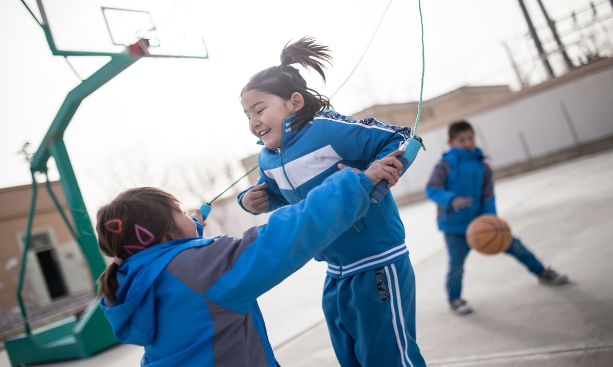 Students play on the playground after school in Daliyabuyi village of Yutian, Northwest China's Xinjiang Uygur Autonomous Reguon on February 28, 2024. Photo: Shan Jie/GT