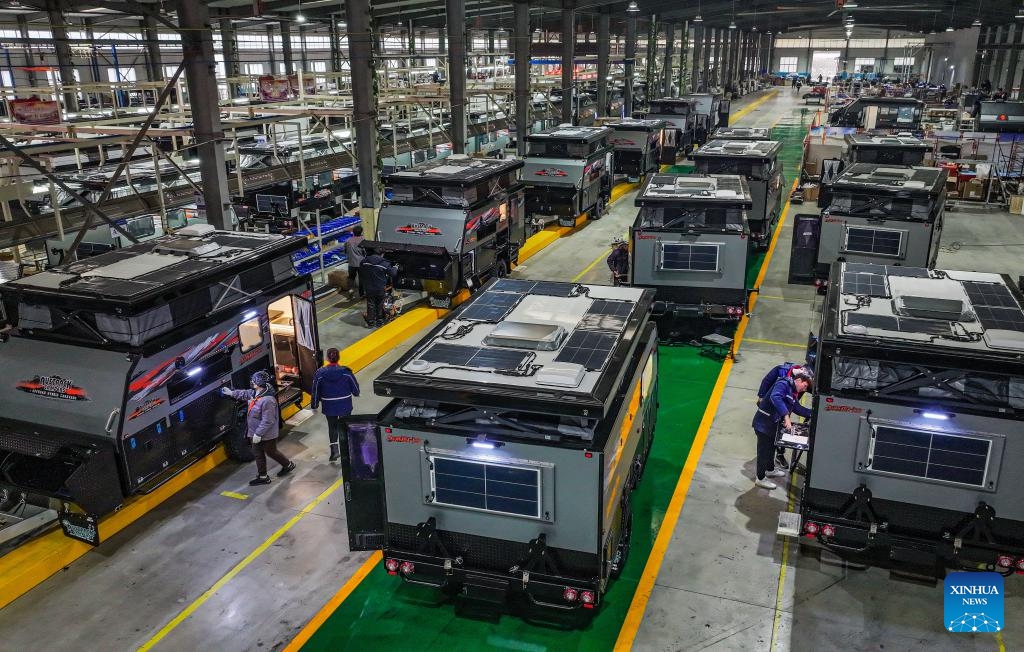 This photo taken on Feb. 18, 2024 shows workers assembling recreational vehicles (RVs) at Rongcheng Compaks New Energy Automobile Co., Ltd. in Rongcheng City, east China's Shandong Province. Rongcheng City in east China's Shandong Province, a major production and export base for recreational vehicles (RVs) in China, registered an export value for RVs at 1.82 billion yuan (about 256 million U.S. dollars) in 2023, marking a year-on-year increase of 17.8 percent, according to official data.(Photo: Xinhua)