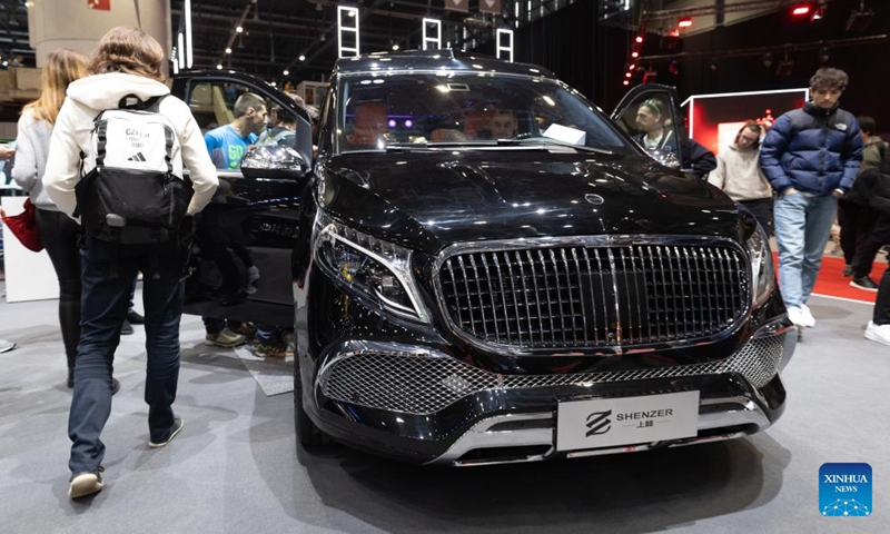 Visitors experience a SHENZER vehicle at the 91st Geneva International Motor Show in Geneva, Switzerland, Feb. 28, 2024. The 91st Geneva International Motor Show opened to the public on Feb. 27 and will last until March 3.(Photo: Xinhua)