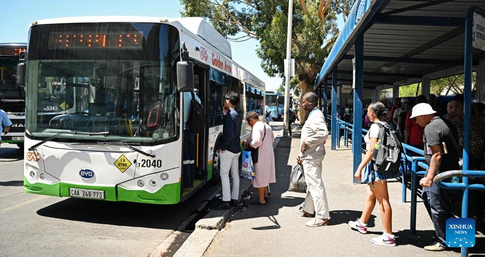 People wait to board a BYD electric bus in Cape Town, South Africa, Feb. 28, 2024. China-made electric buses have been incorporated into the day-to-day operations of Golden Arrow Bus Services here.(Photo: Xinhua)