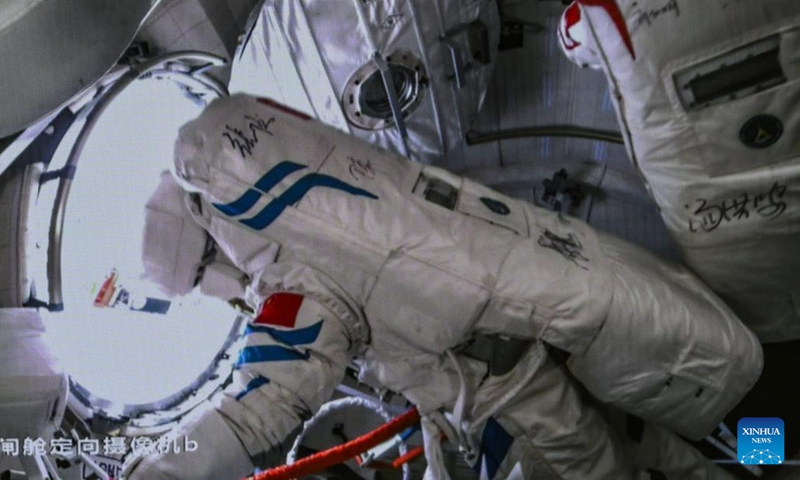 This screen image captured at Beijing Aerospace Control Center on March 2, 2024 shows Shenzhou-17 astronauts Tang Hongbo (R) and Jiang Xinlin (L) returning to the Wentian lab module. The Shenzhou-17 crew members, who are currently on board China's space station, have completed their second extravehicular mission on Saturday. (Photo: Xinhua)
