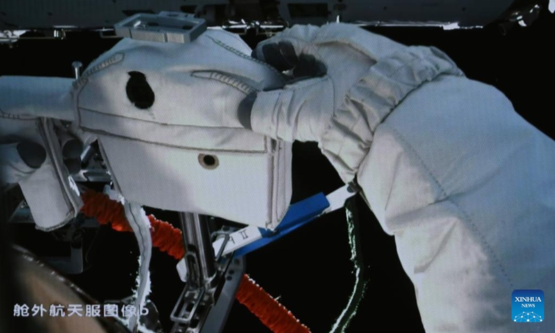 This screen image captured at Beijing Aerospace Control Center on March 2, 2024 shows Shenzhou-17 astronaut Jiang Xinlin collecting image data while performing extravehicular activities. The Shenzhou-17 crew members, who are currently on board China's space station, have completed their second extravehicular mission on Saturday. (Photo: Xinhua)