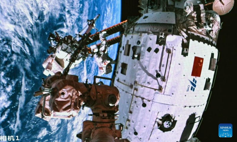 This screen image captured at Beijing Aerospace Control Center on March 2, 2024 shows Shenzhou-17 astronaut Tang Hongbo performing extravehicular activities. The Shenzhou-17 crew members, who are currently on board China's space station, have completed their second extravehicular mission on Saturday. (Photo: Xinhua)