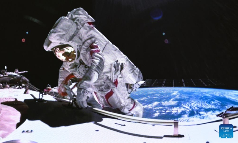 This screen image captured at Beijing Aerospace Control Center on March 2, 2024 shows Shenzhou-17 astronaut Tang Hongbo performing extravehicular activities. The Shenzhou-17 crew members, who are currently on board China's space station, have completed their second extravehicular mission on Saturday. (Photo: Xinhua)