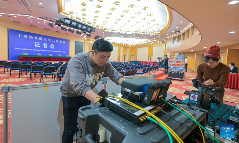 People work at the press center for China's upcoming annual legislative and political consultative sessions in Beijing, capital of China, Feb. 27, 2024. The press center opened Tuesday at the Media Center Hotel in Beijing.The second session of the 14th National People's Congress (NPC) and the second session of the 14th National Committee of the Chinese People's Political Consultative Conference (CPPCC) will open on March 5 and 4, respectively. Photo: Xinhua