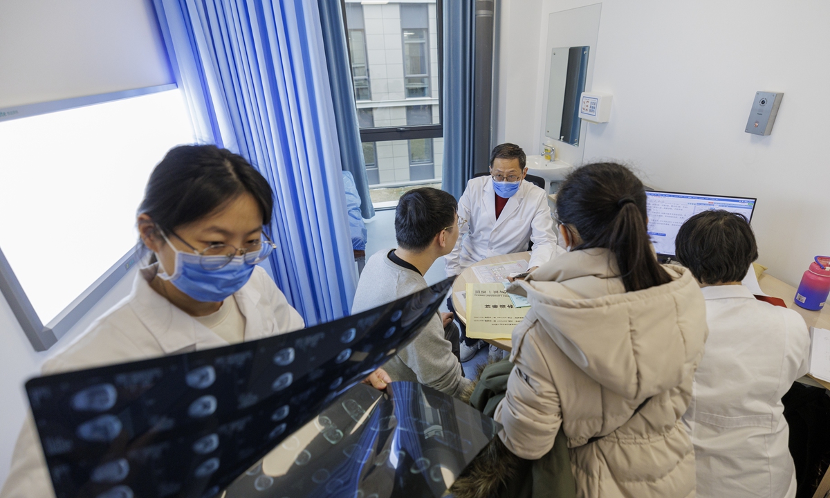Doctors conduct medical inspection for a patient (second from left) diagnosed with myositis at the Peking University First Hospital on February 19, 2024. Photo: VCG